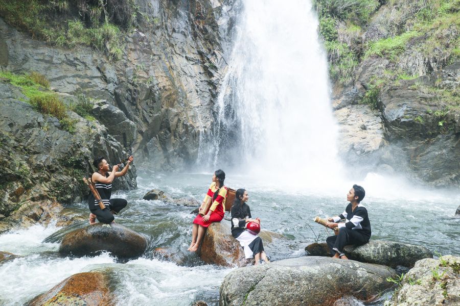 At the foot of the waterfall, a clear, turquoise pool offers the perfect place to cool down on hot days