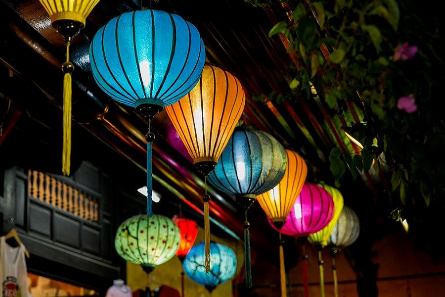 Local people hang lanterns in front of their houses to attract luck