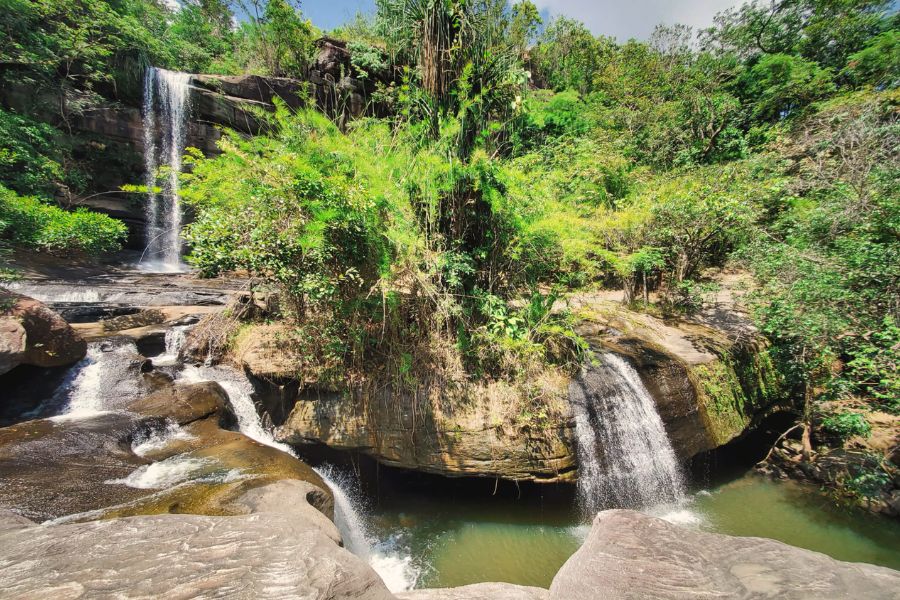 Scenic waterfall surrounded by lush greenery in Khong Chiam