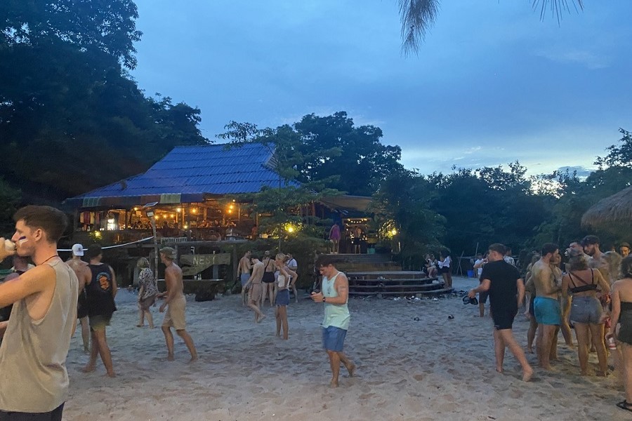 Gather at a beachside bar and have fun together
