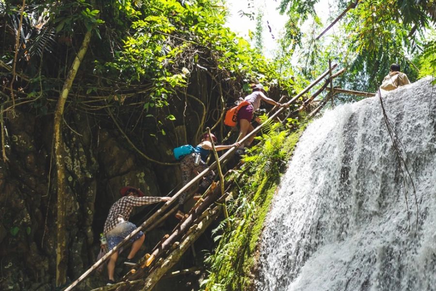Exploring lush waterfalls along the classic 7-day Northern Laos route
