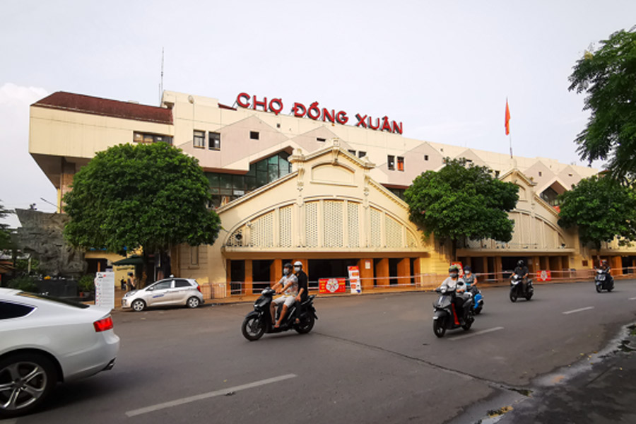 Enjoy the bustling atmosphere and shopping to your heart's content at Dong Xuan market