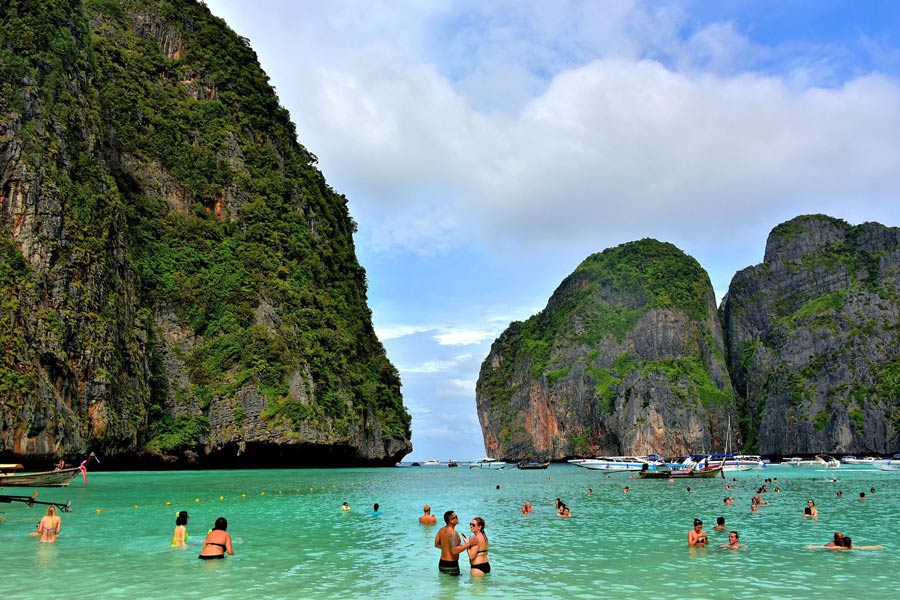 Swimming at Koh Phi Phi Leh and Maya Bay is a captivating experience, allowing you to immerse yourself in the pristine turquoise waters surrounded by stunning natural beauty