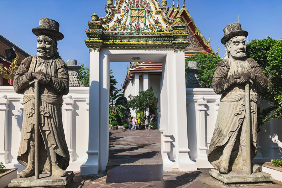  Yaksha and Yakshini statues are guardian figures commonly found in various Buddhist and Hindu temples, including the Wat Pho temple complex