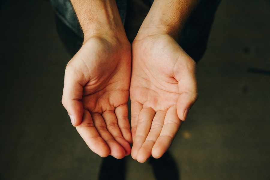 According to Malaysian cultural etiquette, you should give and take using both hands
