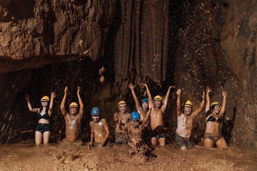 Visitors enjoy thrilling zipline at the entrance of Toi Cave 