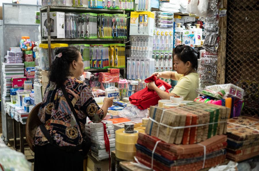 Enjoy the bustling atmosphere and shopping to your heart's content at Dong Xuan market