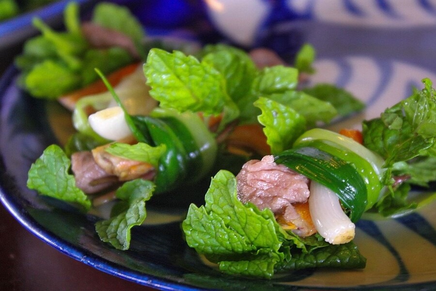 Tam Huu spring rolls taste best when made with Tra Que herbs