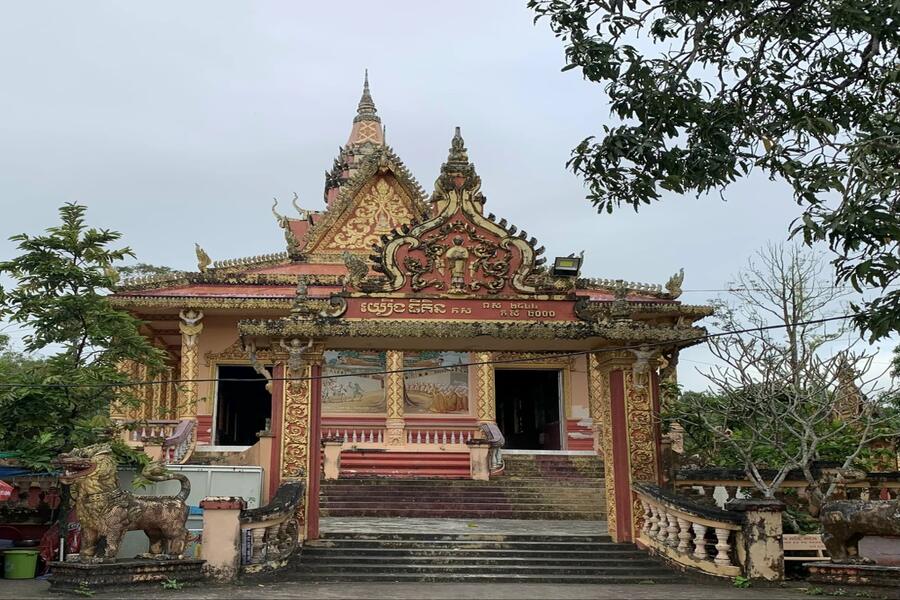 The ancient gate contrasts with the grandeur inside