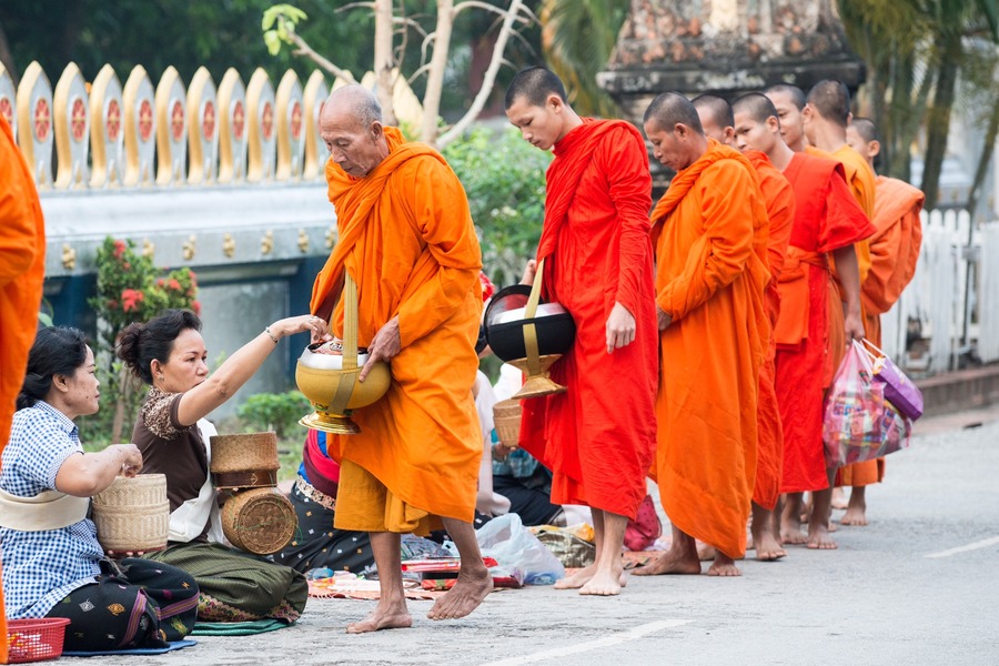 As a return, the monks also bless the people with good fortune. Photo: Daniel Marchal