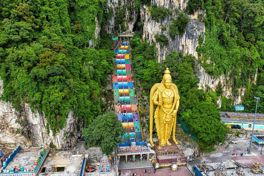 Many caves are nestled within lush rainforests or near waterfalls