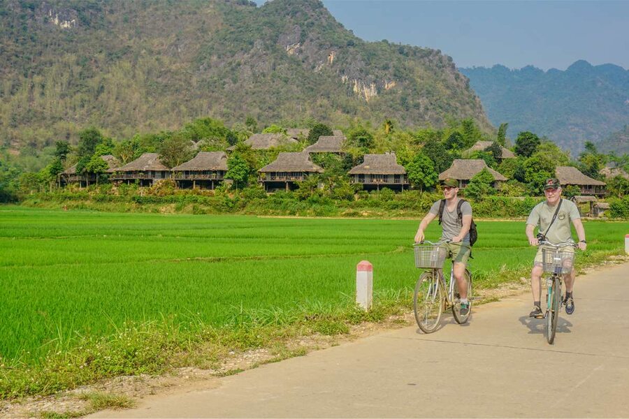 Cycling along the rice fields and stilt houses in Ban Lac. Photo: Local Vietnam