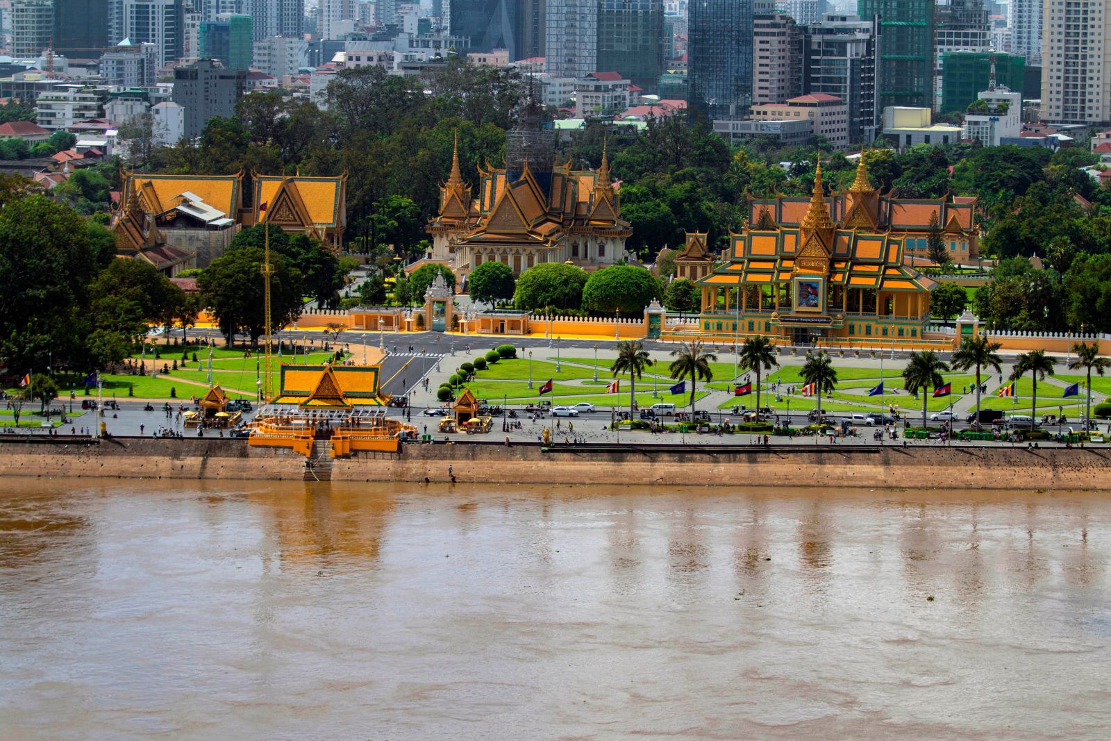 This stunning aerial view of Phnom Penh, Cambodia, showcases the vibrant cityscape and the river that flows through the city