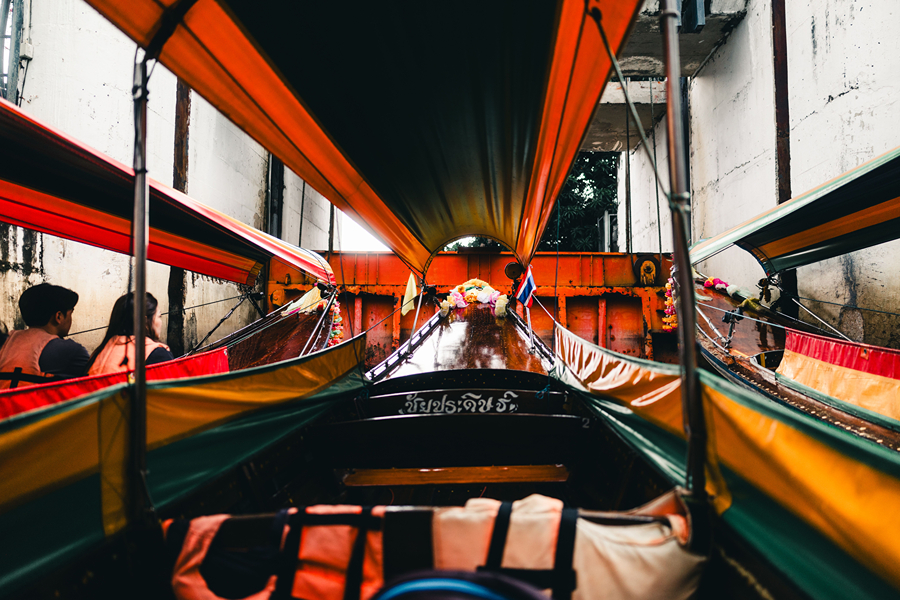 Travelling on a longtail boat is a must-try activity when visit Thailand