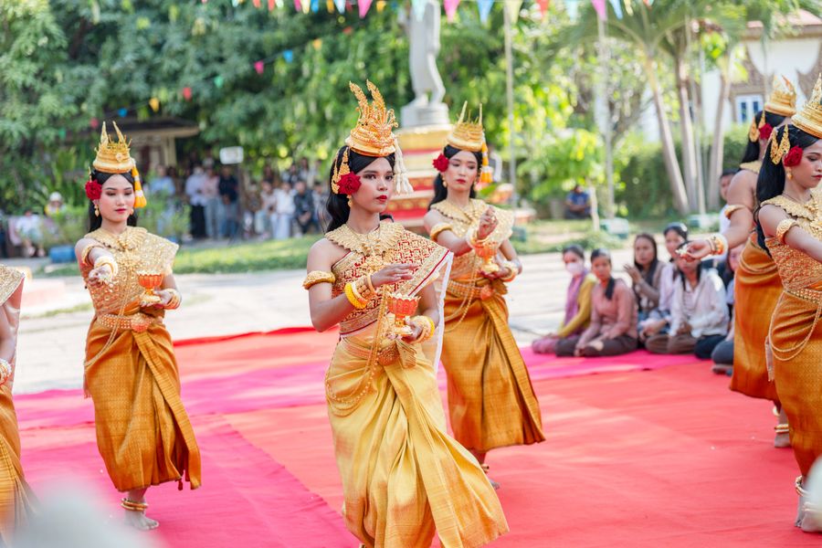 Graceful Khmer dancers in vibrant traditional costumes perform in Battambang, Cambodia.