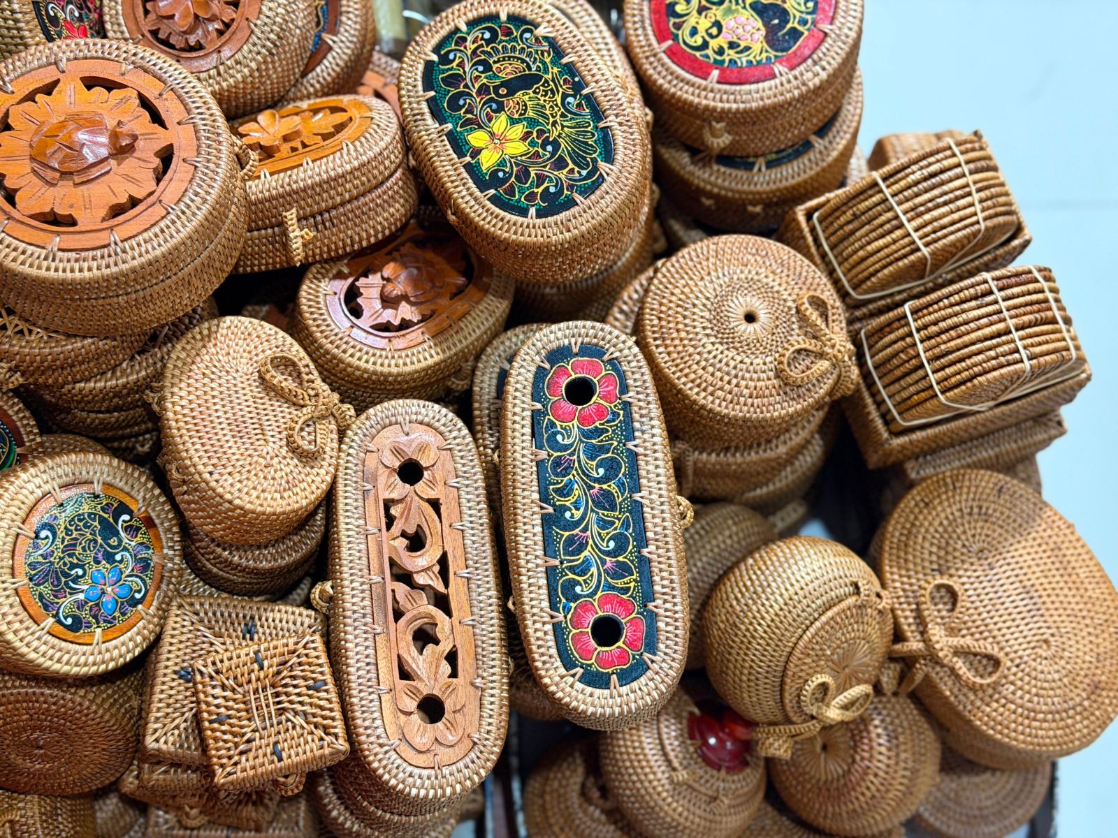 A collection of handcrafted wicker and rattan baskets featuring exquisite woven and painted designs