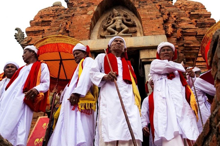 Kate Festival Cham religious dignitaries participating in a traditional ceremony at a Cham tower