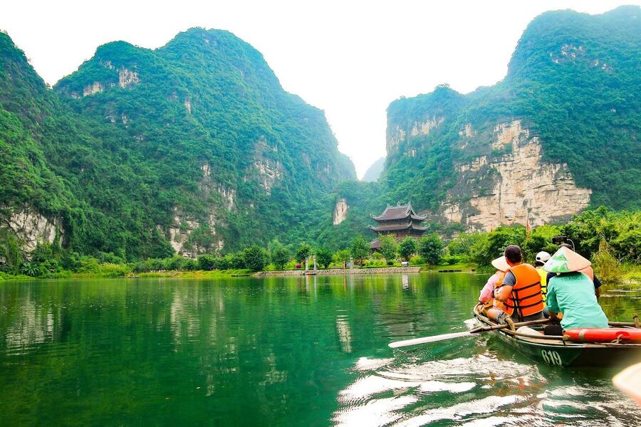 Enjoying the scenic beauty from a boat. Photo: Vietjet Air