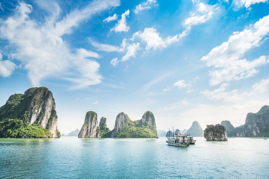 A clear sky and a gentle sea breeze will make a visit to Ha Long Bay perfect. Photo: VnExpress