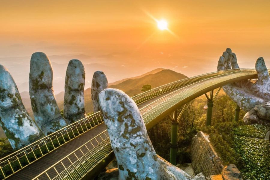Golden Bridge at Sunset: A Dreamlike Scene Above the Clouds in Da Nang