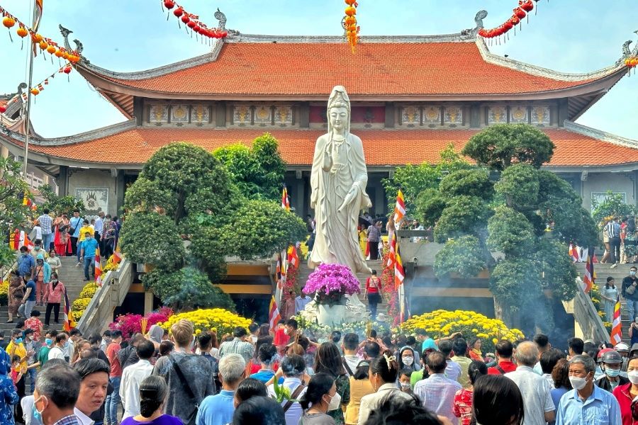 Vietnamese people often go to pagodas during the Tet Holiday
