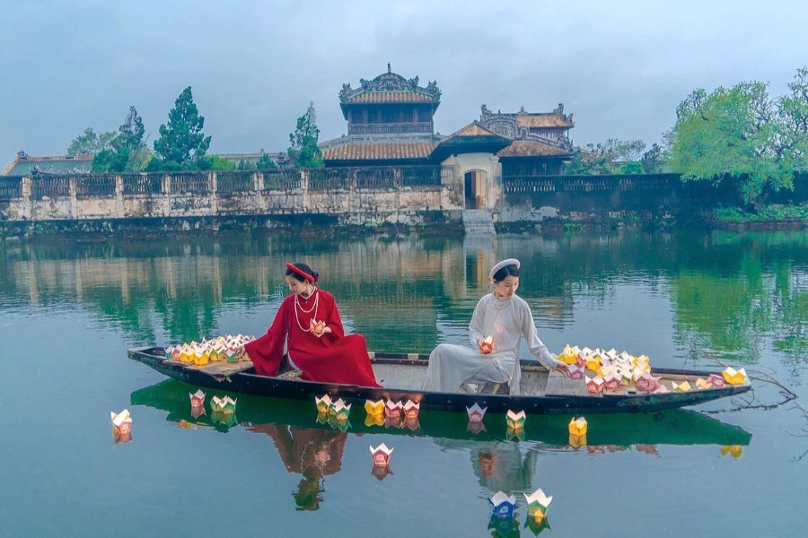 Releasing lanterns on the Perfume River in Hue