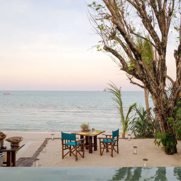 Private dinner on a beach at sunset