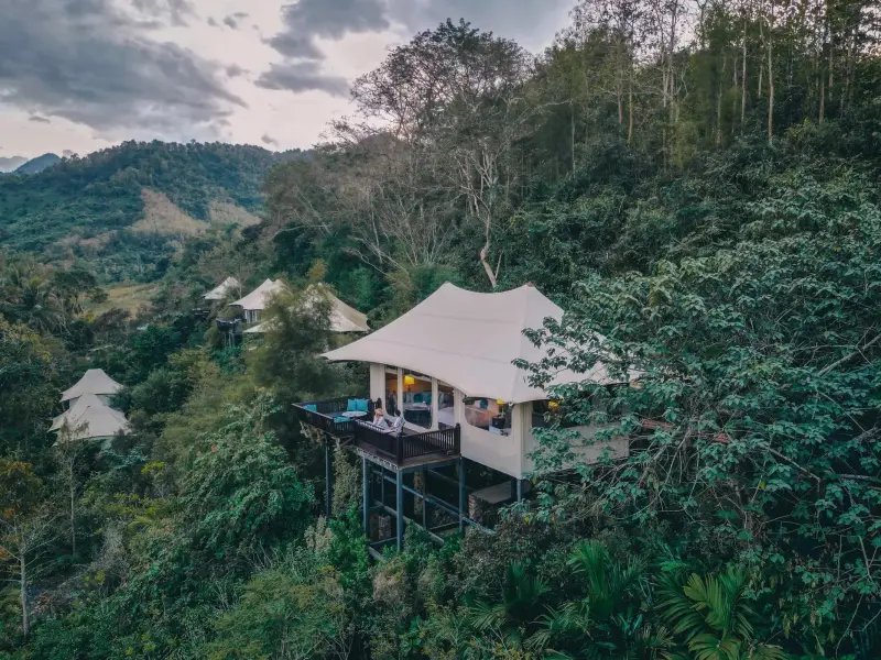 A tented villa among the trees at Rosewood Luang Prabang
