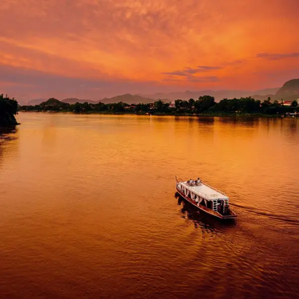 A private boat on the Mekong at sunset