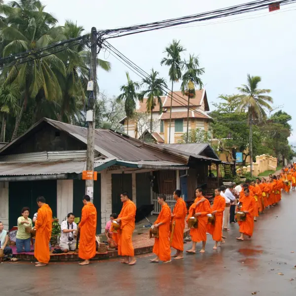 Monks collecting alms at dawn in Luang Prabang